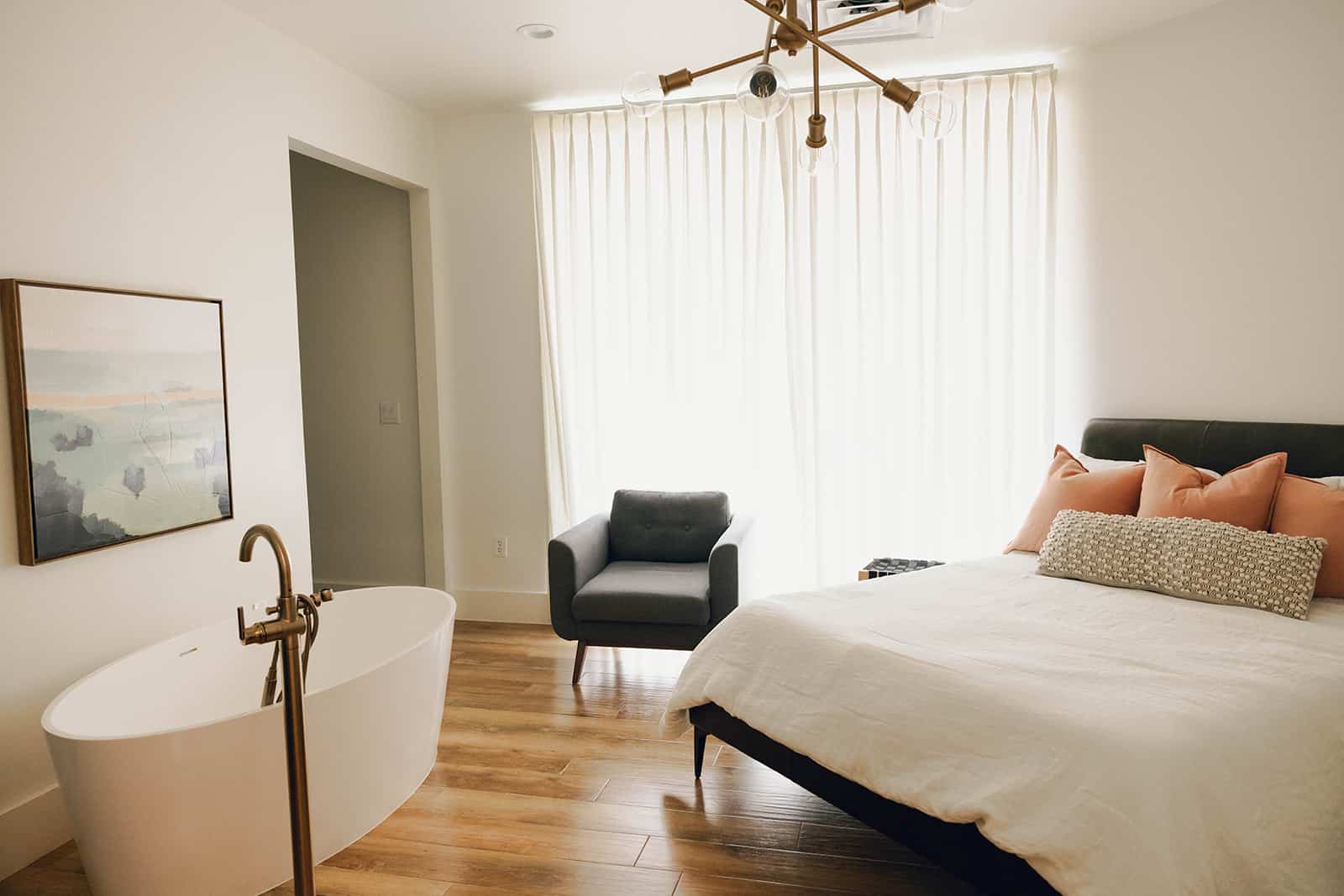 The Addice birth suite with a freestanding tub, comfortable bed and natural light